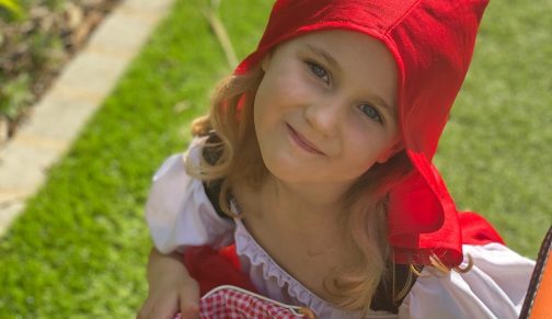 girl dressed as little red riding hood