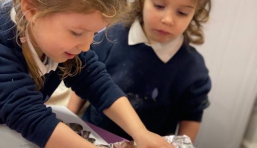 girls making gingerbread men