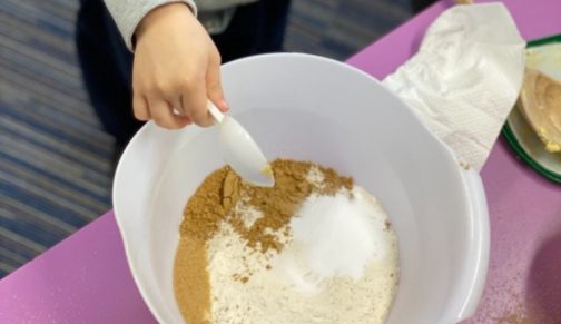 child mixing ingredients