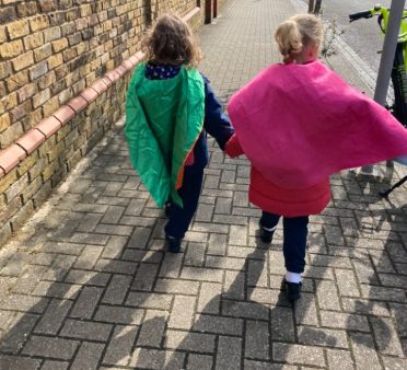 Girls dressed as superheroes for walk to school week