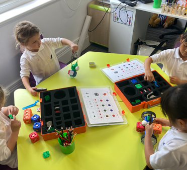 Young pupils doing robotics