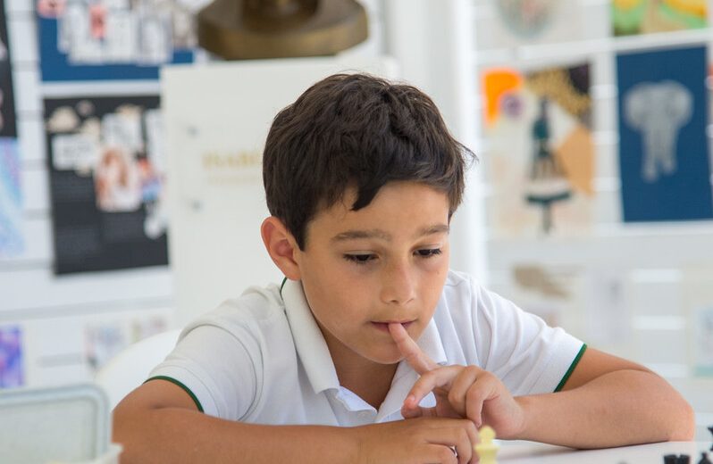 boy playing chess