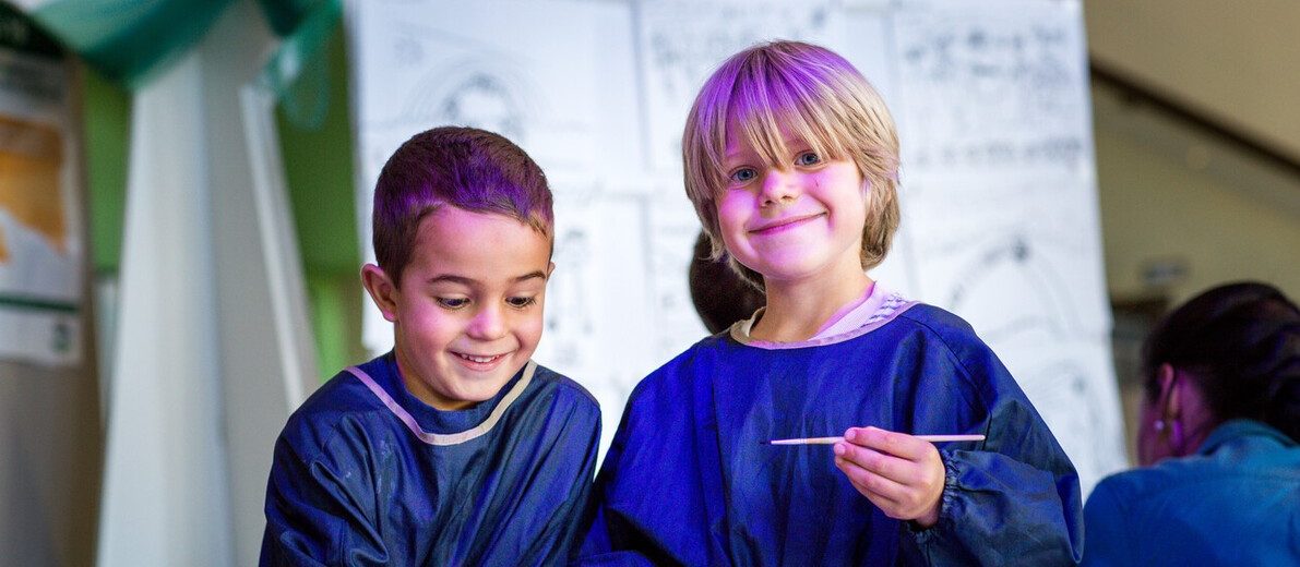 students in painting clothes