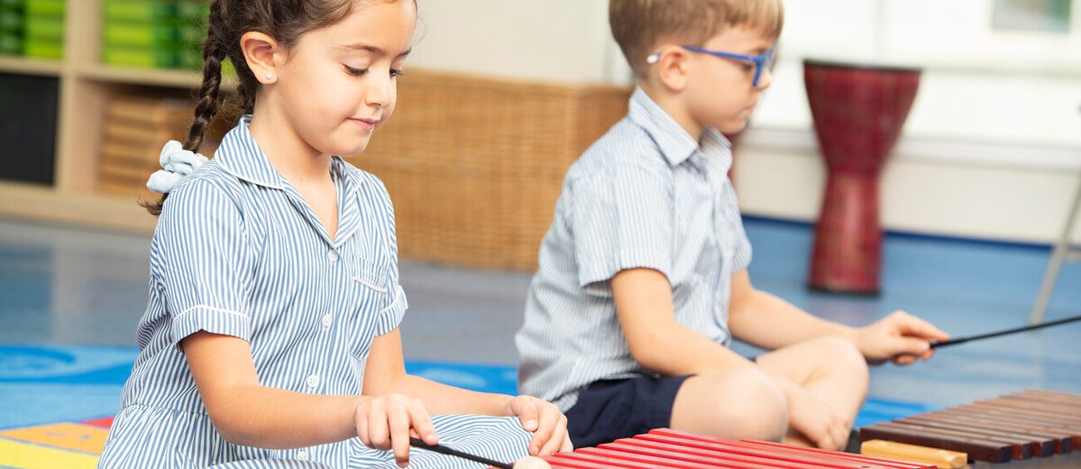 children playing with xylophones