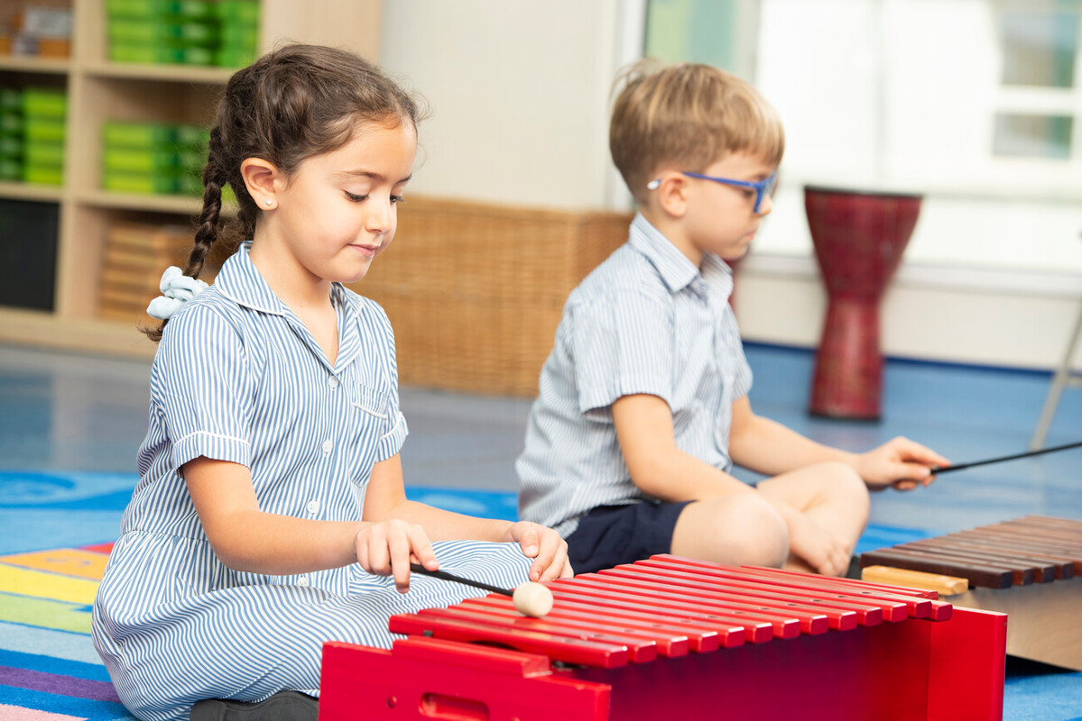 children playing with xylophones